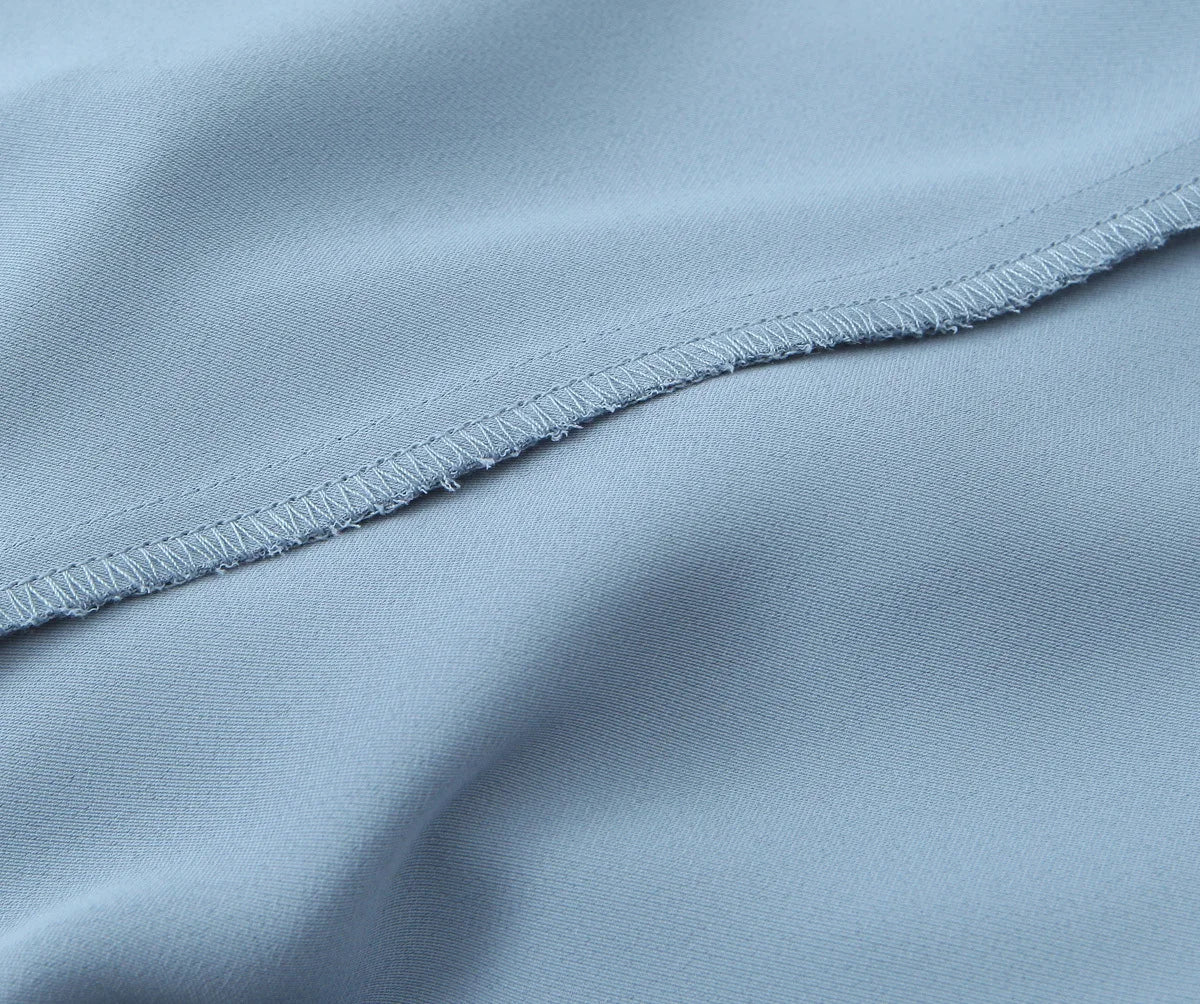 Top a Fascia Drappeggiato e Pantalone Sartoriale