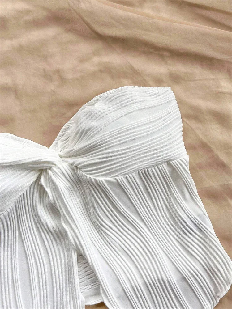 Haut blanc drapé d'été